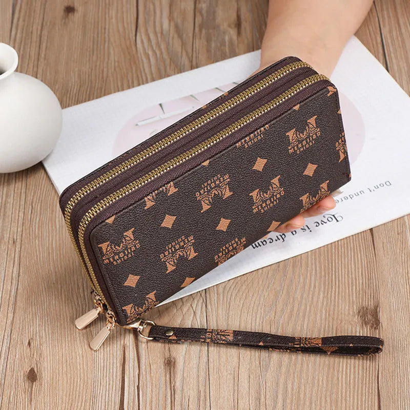 Long black PU leather wallet clutch with phone slot, card holders, and zippered coin purse