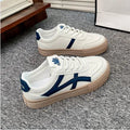 Low top casual shoes with artificial PU upper and injection moulded rubber sole in blue or brown