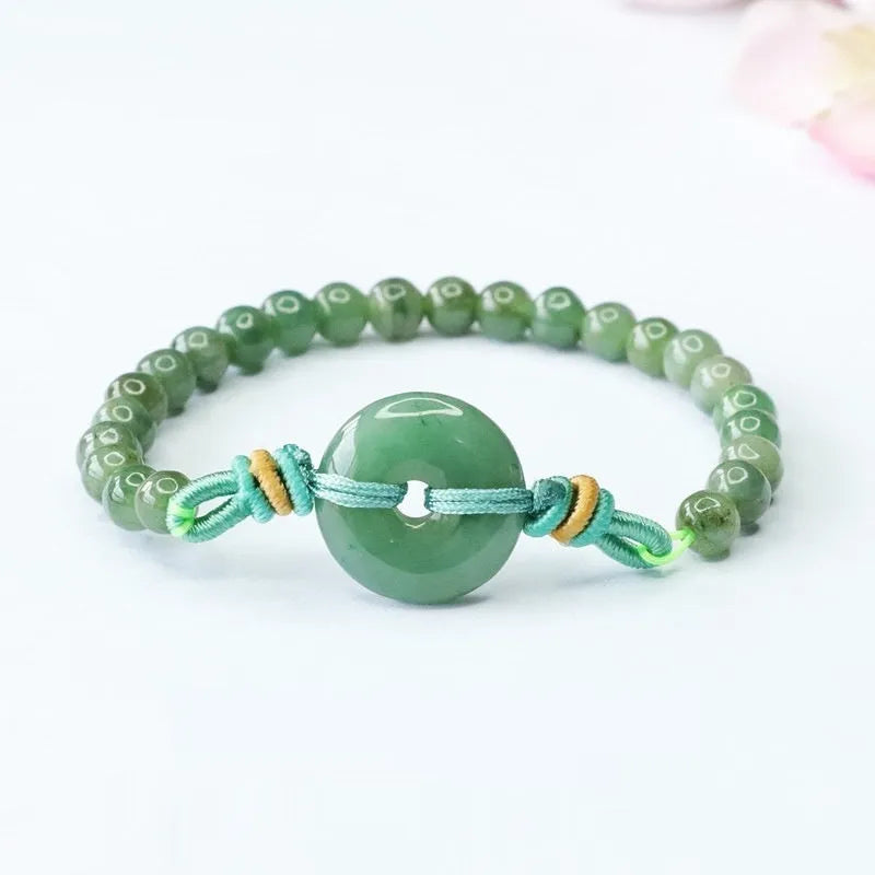 Oil green jade bracelet with safety buckle and star shape design measuring 6mm thickness