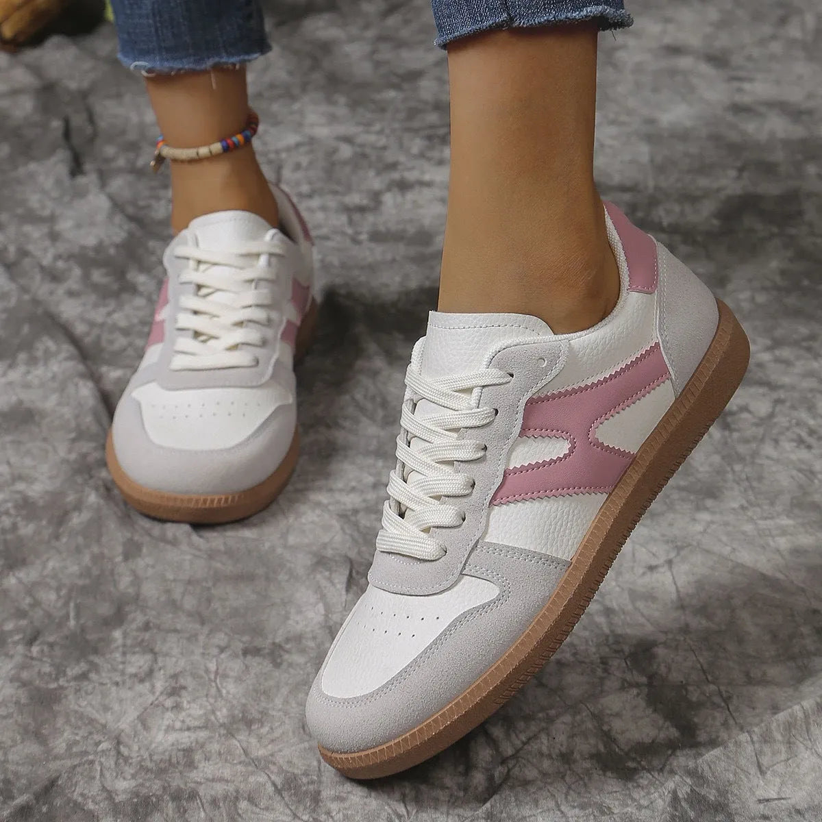 Women's retro casual sneaker in a wine red colour with a round toe, flat rubber sole, and front lace-up fastening.