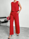 Red sleeveless top and wide leg trouser two-piece set laid flat, showing Asian sizing label.
