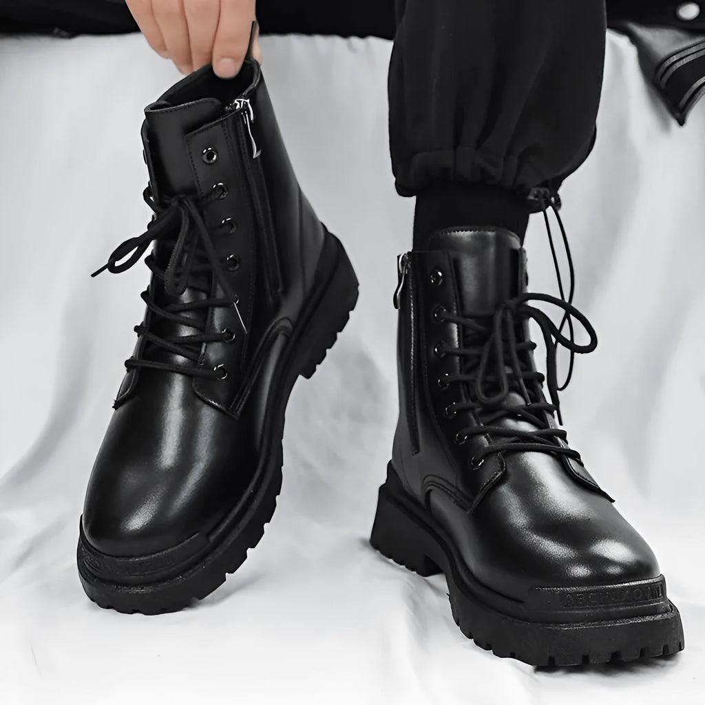 Men's black mid-top British Tide style leather boots with a rubber sole on a white background.