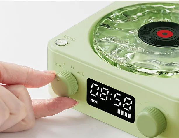 Blue retro-style Bluetooth speaker with rotating transparent turntable and RGB projection lighting