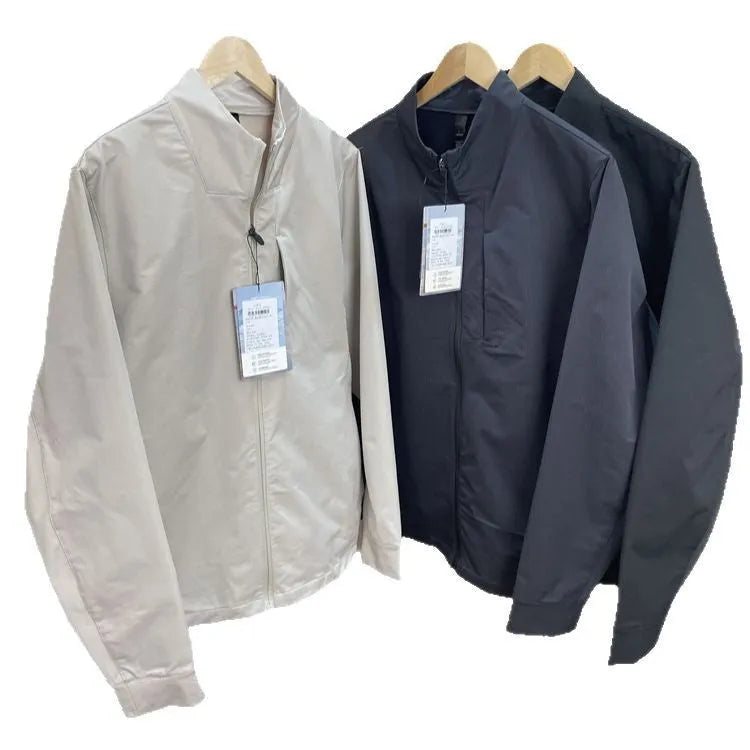 Men's beige stand collar polyester casual jacket with long sleeves and straight hem.