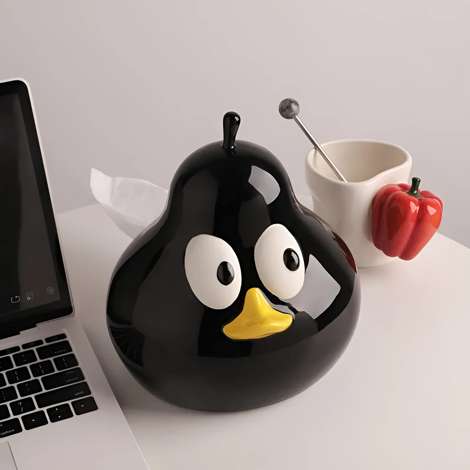 Ceramic pear-shaped tissue box holder in white porcelain with animal design for desktop use