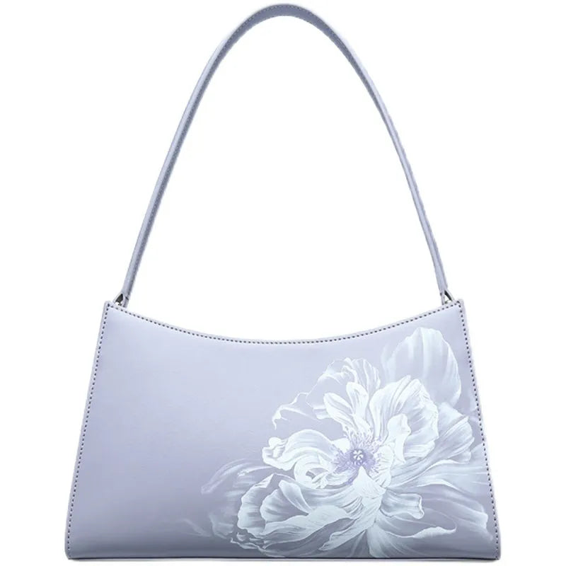 Light purple cowhide leather handbag with zipper closure, compact size for everyday use