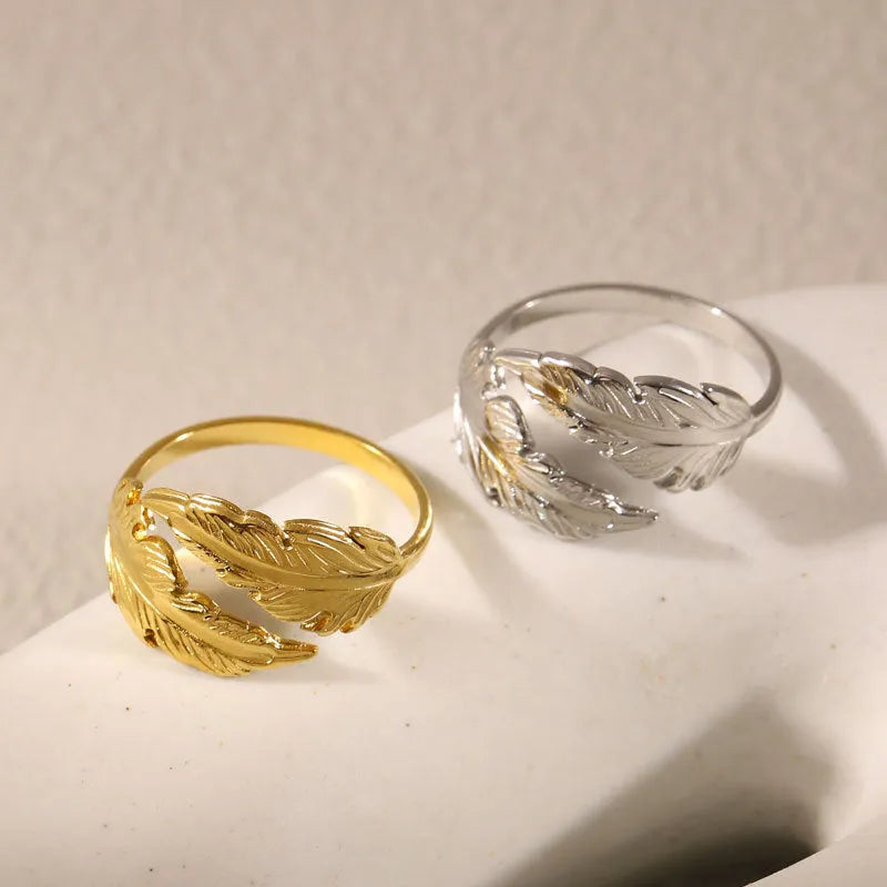 Women's adjustable stainless steel feather ring in gold and silver colour options