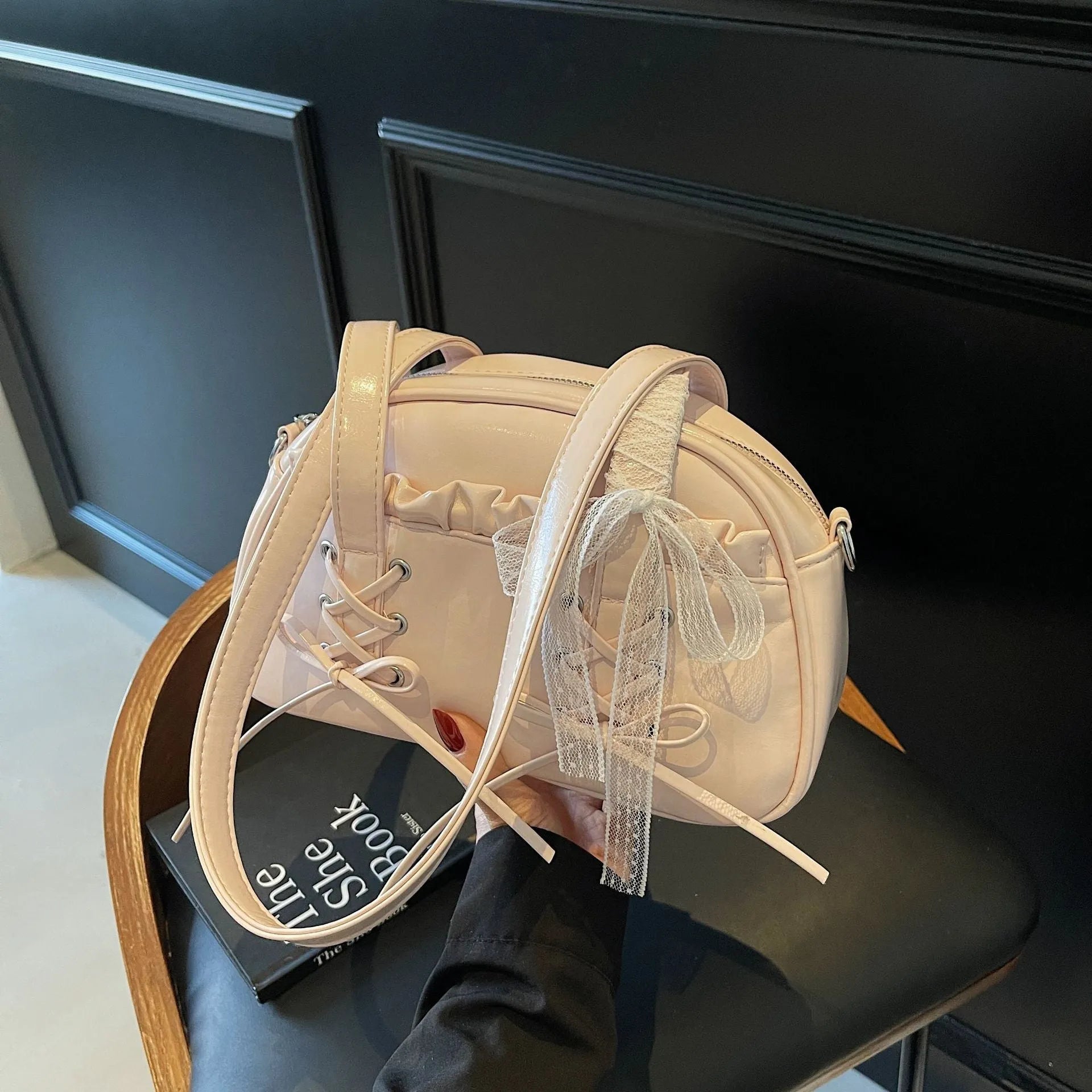 PU leather ladies shoulder bag with bandage bow design and decorative sewing thread in milky white colour