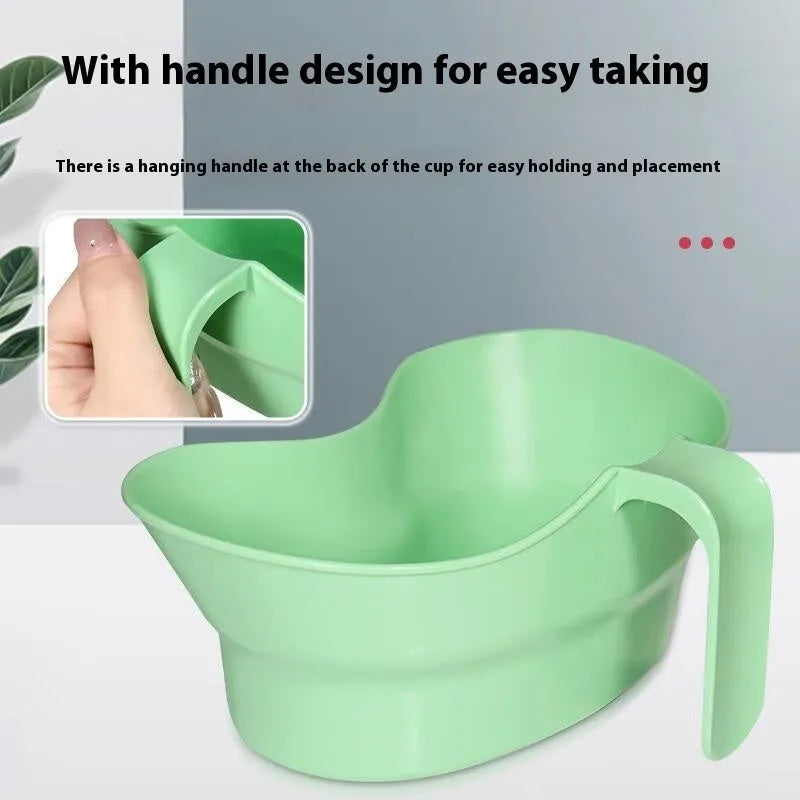Green plastic gargle cup for bedridden patient oral care assistance