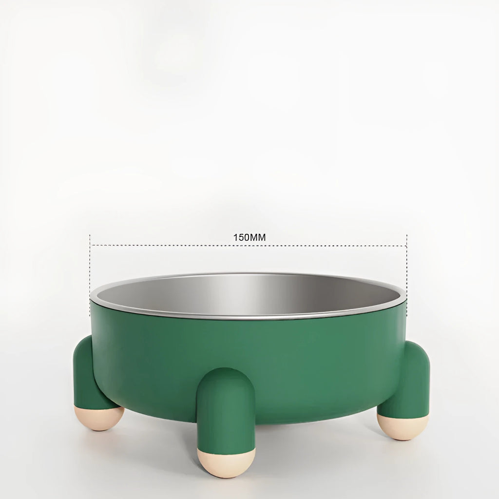Green stainless steel pet bowl with non-slip base and high foot on a kitchen floor.