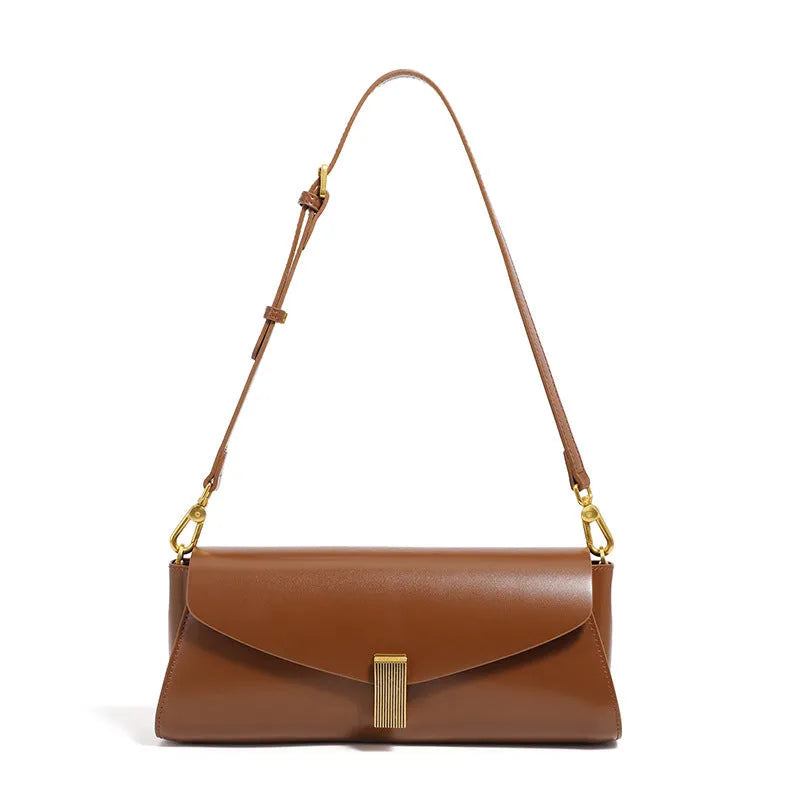 A pillow-shaped women's cowhide leather cross-body bag with a clamshell opening, shown in a choice of colours.