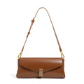 A pillow-shaped women's cowhide leather cross-body bag with a clamshell opening, shown in a choice of colours.