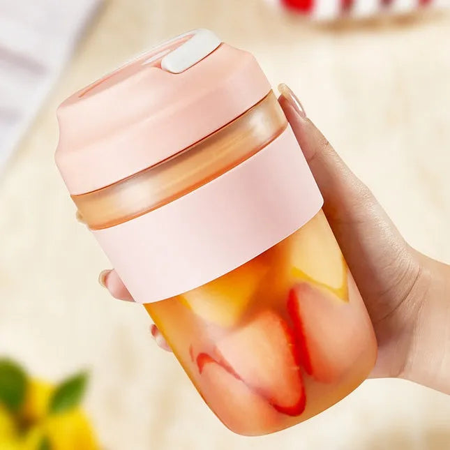 Portable purple rechargeable blender cup with four stainless steel blades, 400ml capacity, shown with USB cable.