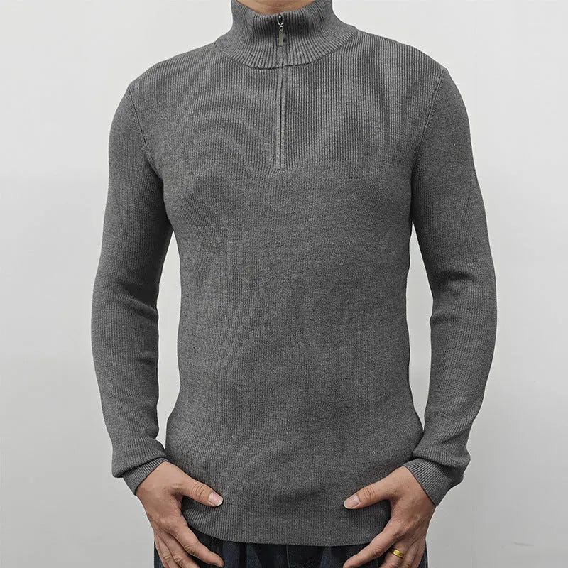 Men's black half turtleneck zipper sweater laid flat showing zip detail and long sleeves