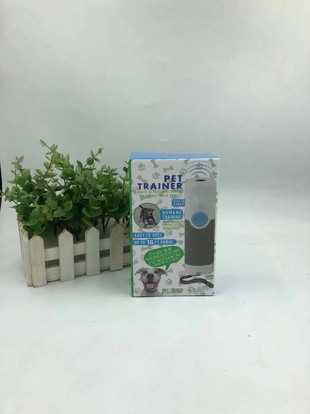 White handheld ultrasonic dog trainer device for bark control and behaviour training
