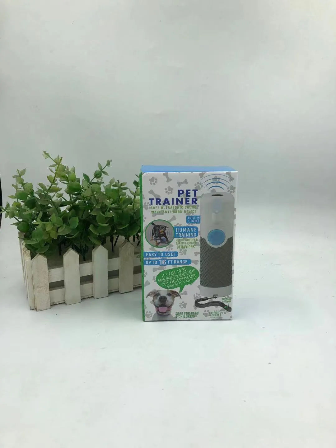 White handheld ultrasonic dog trainer device for bark control and behaviour training