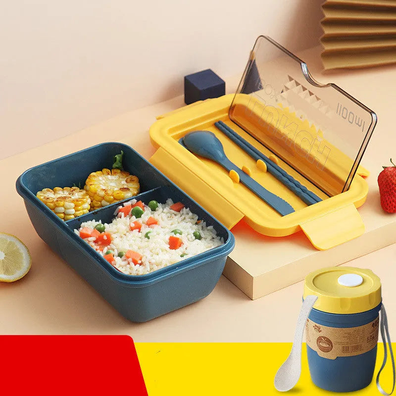 Green plastic bento lunch box with four food compartments showing Nordic design