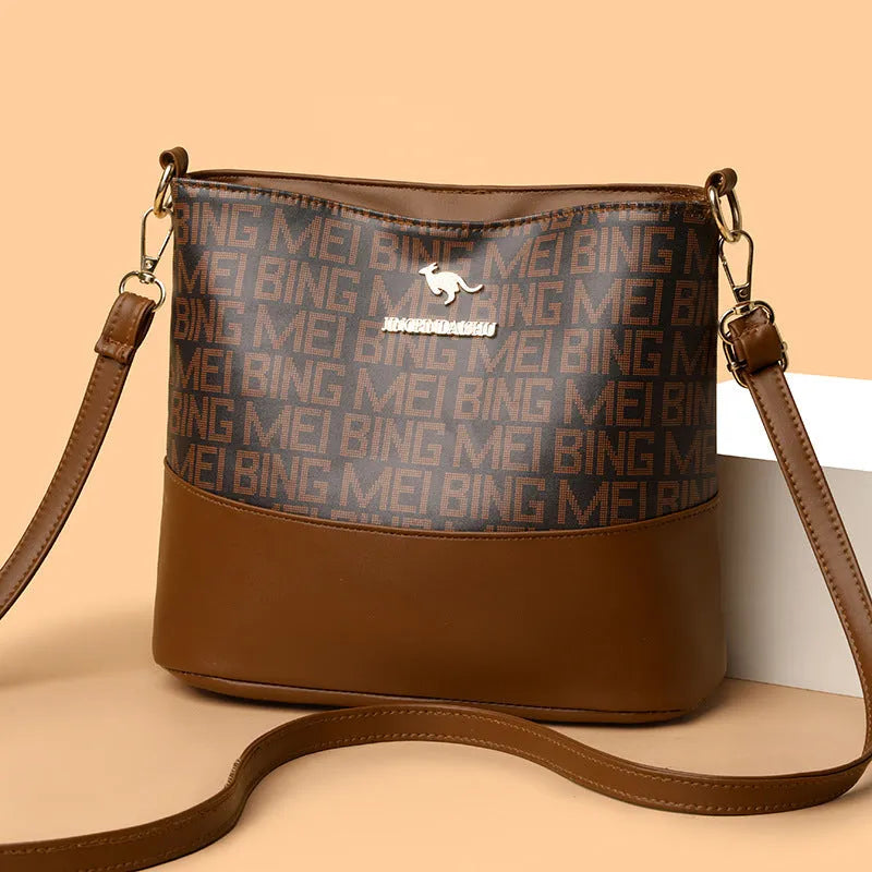 Brown soft leather messenger bag showing three-dimensional pocket and internal organisation compartments
