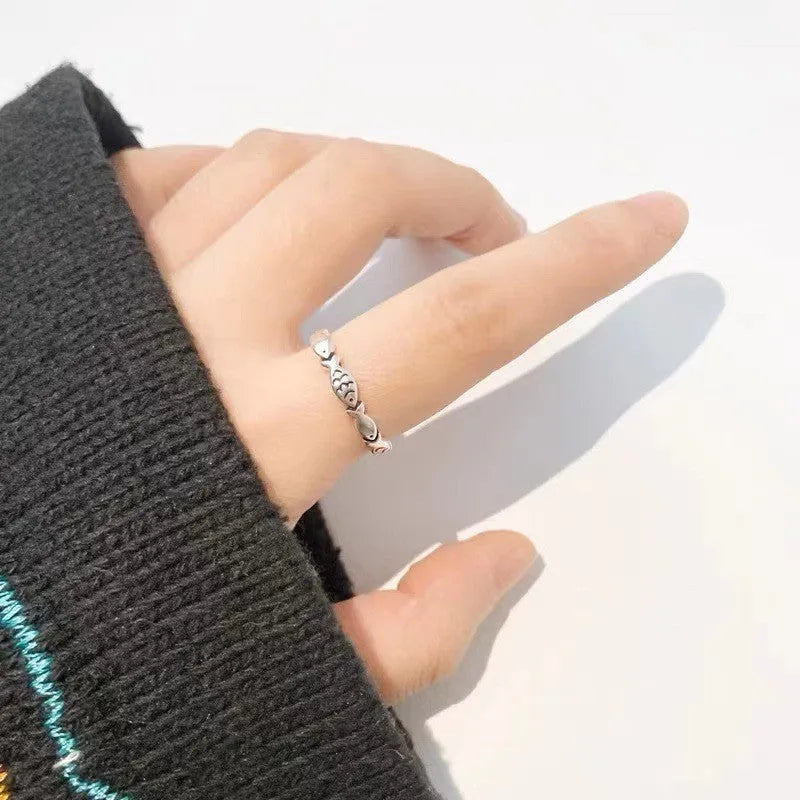 Women's adjustable sterling silver fish ring with carp zodiac design and open mouth sizing