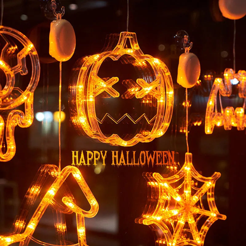 Halloween window hanging LED lights set with seven plastic decorations including spider, pumpkin, and ghost designs