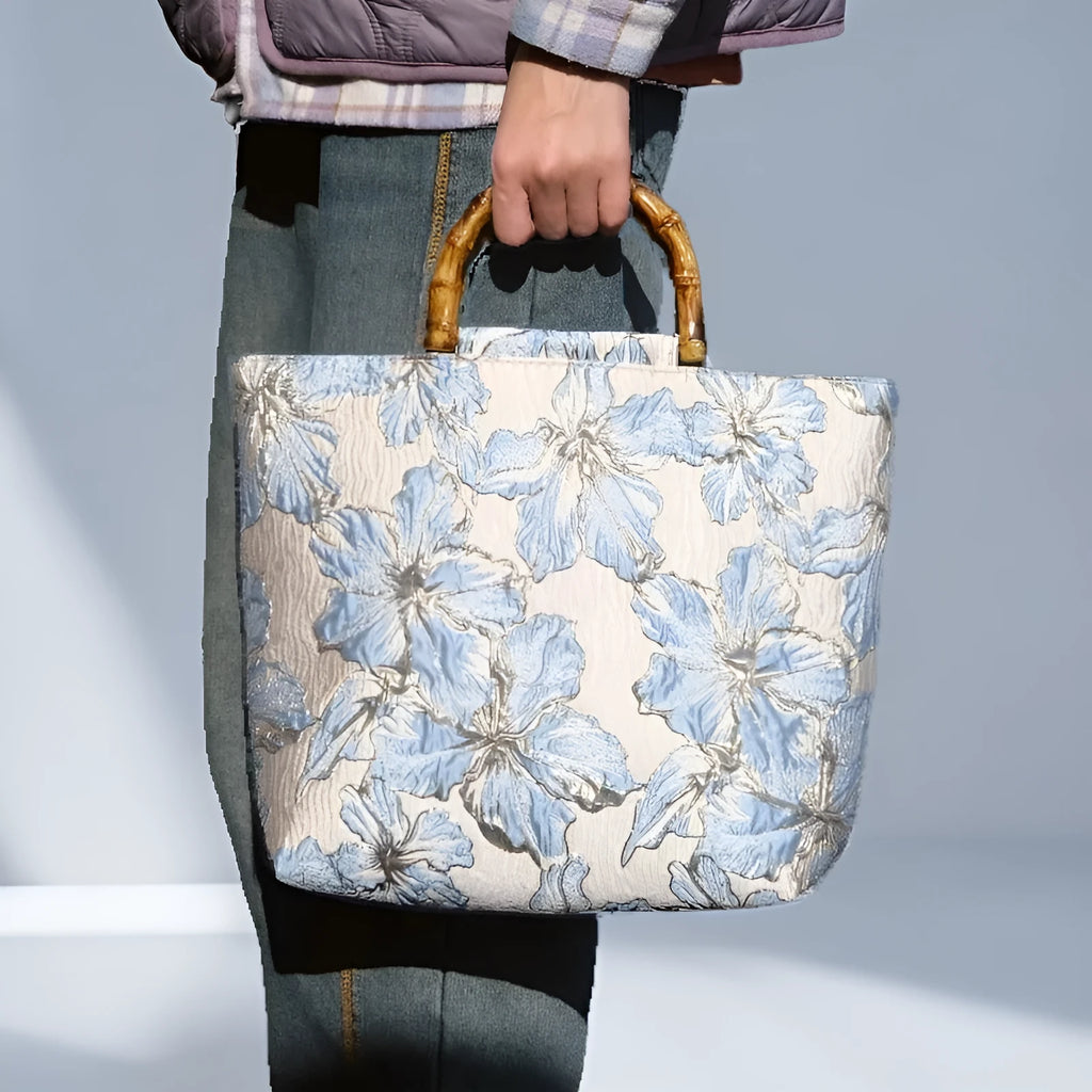 Women's light blue canvas bag with bronzing flower detailing and double shoulder straps
