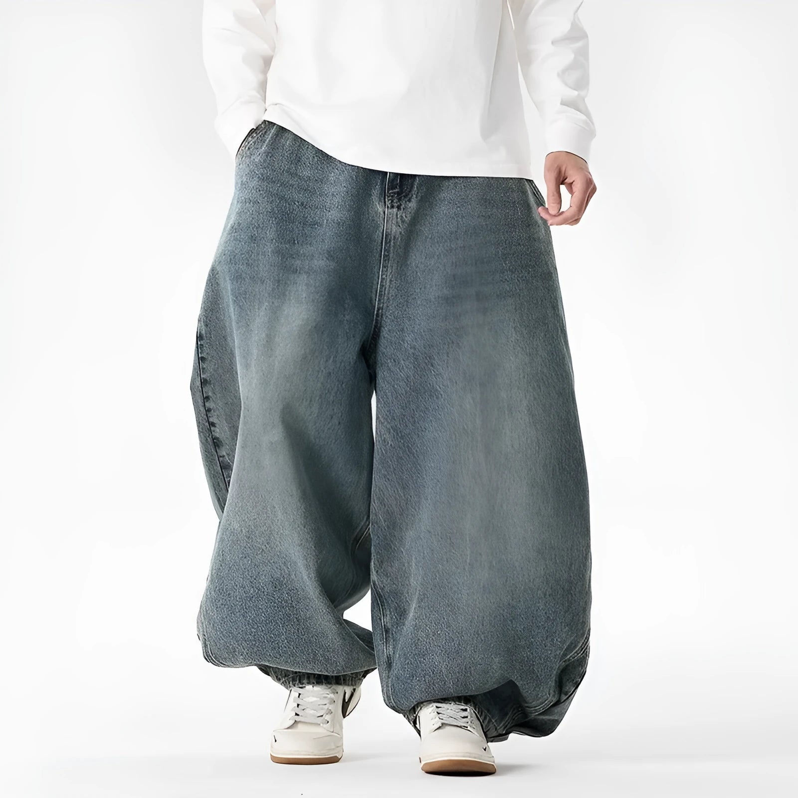 Men's plus size light blue baggy wide-leg jeans on a hanger, showing straight leg and low waist.