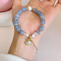 Handmade bracelet with a natural blue-green aquamarine pearl shell on an adjustable band.