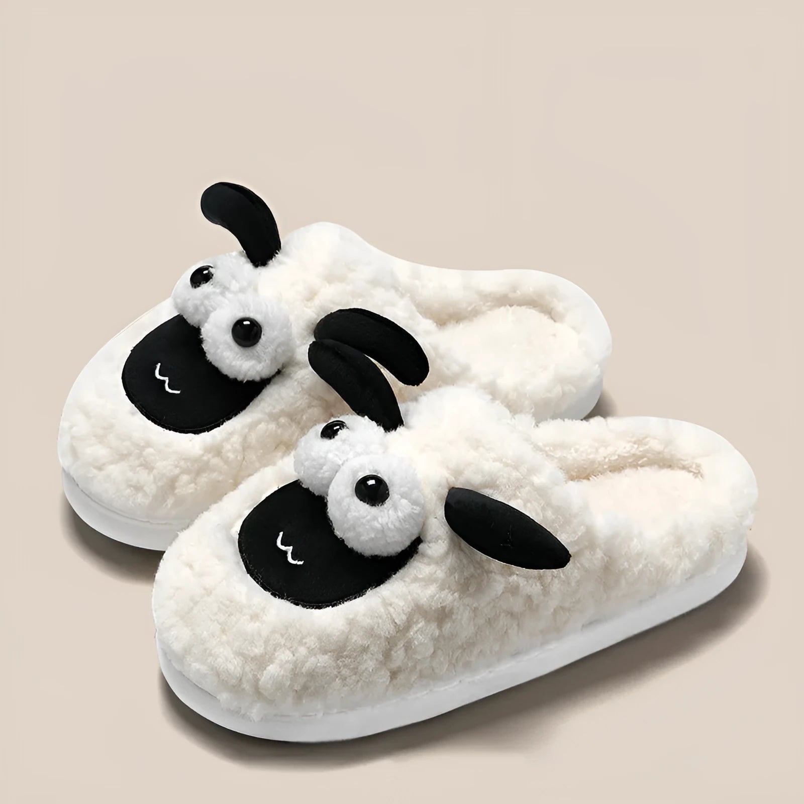 Brown lamb thermal cotton slip-on slippers with suede upper and PVC sole on a wooden floor.