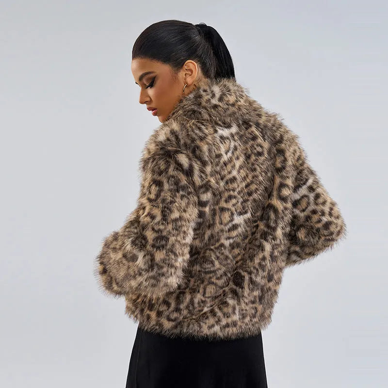 Women's leopard print coat with a buckle on the lapel.