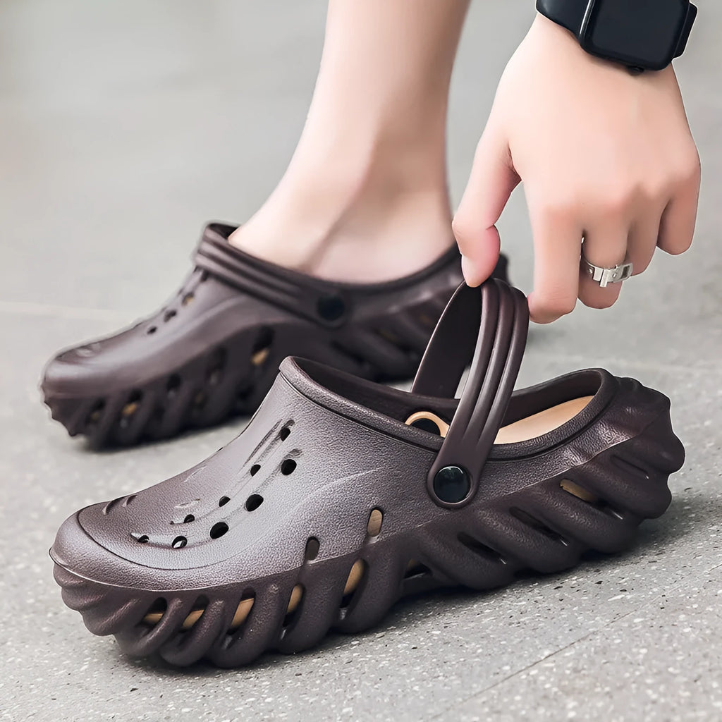 Men's beige EVA slipper sandals with hollow-out design and non-slip sole.