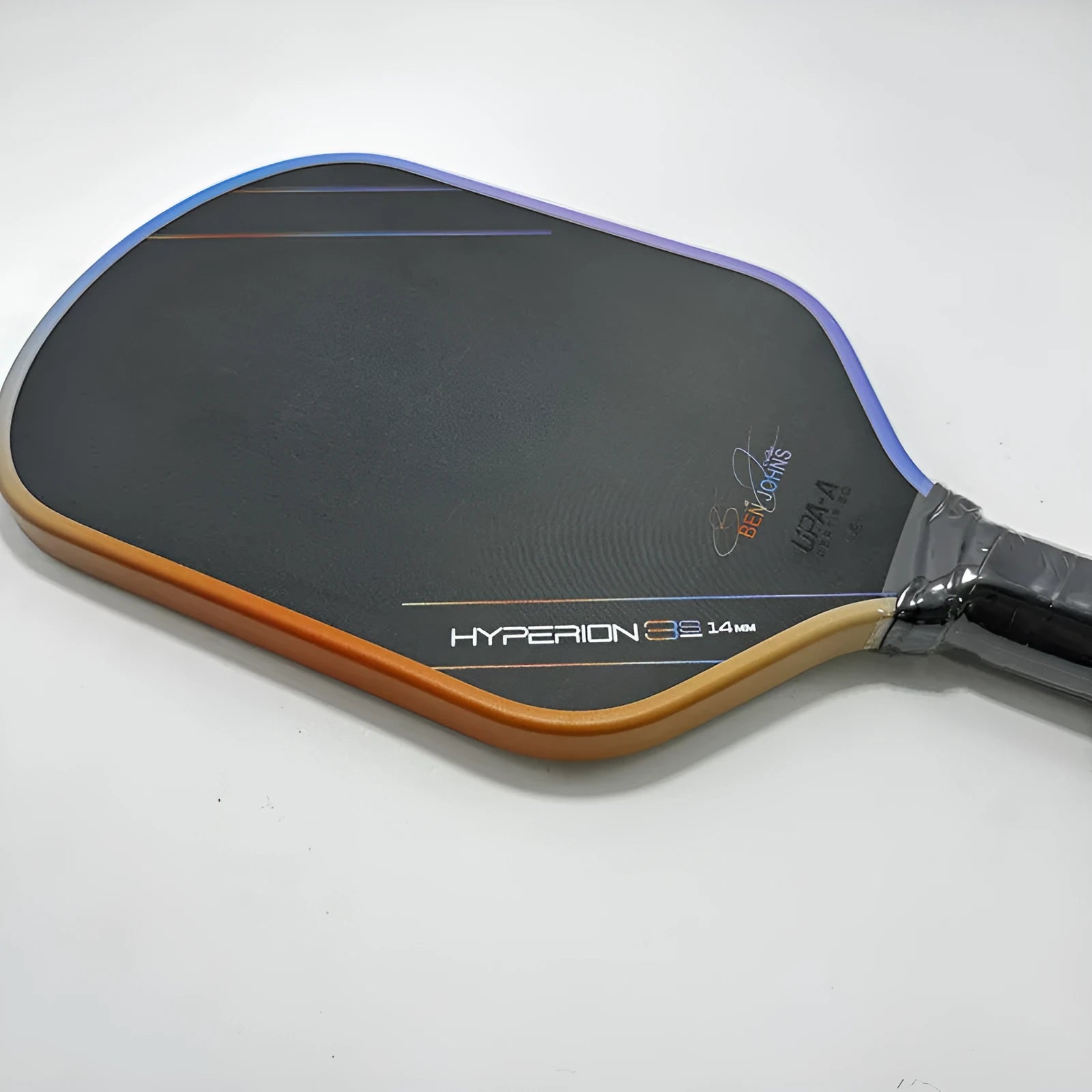 Aurora Multicolor Hyperion 3s pickleball racket showing carbon fibre construction and multicolour pattern