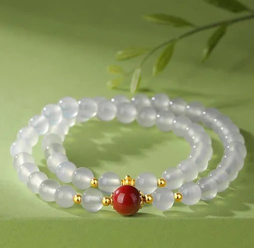 White agate double layer bracelet with jequirity bean cinnabar charm in geometric design