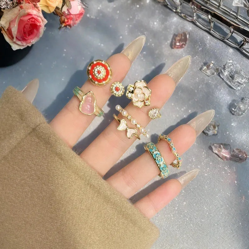 Adjustable copper gourd ring with inlaid zircon stones in New Chinese style featuring floral and bow designs