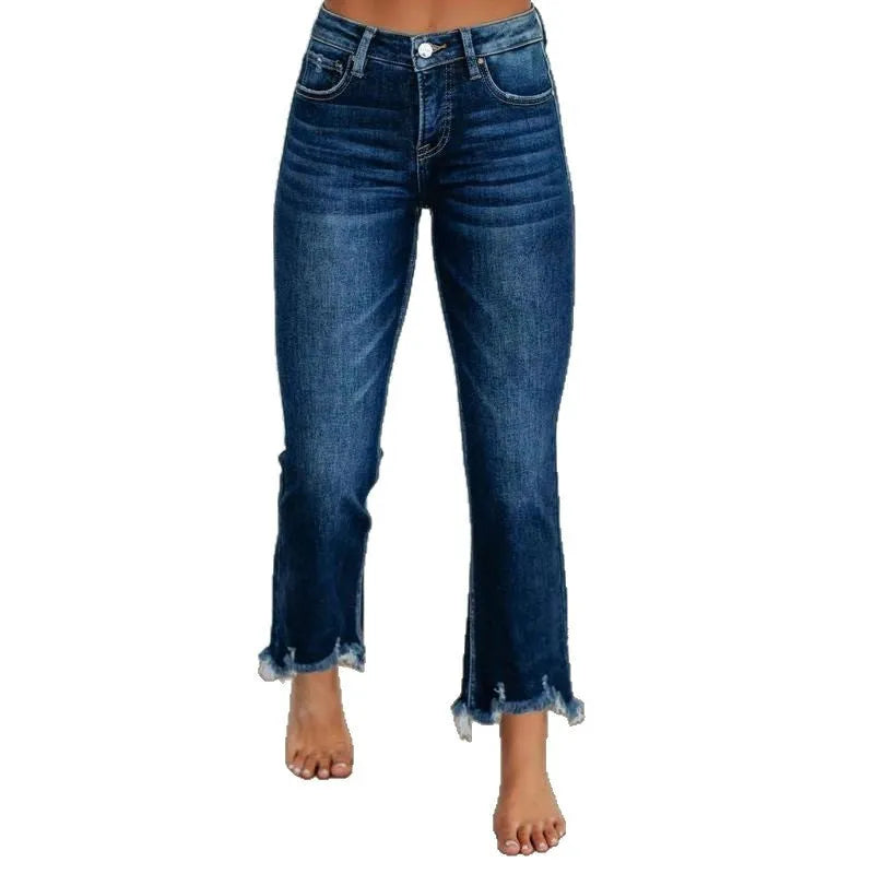 Women's dark blue cotton denim jeans with hand-worn distressing detail on the front.
