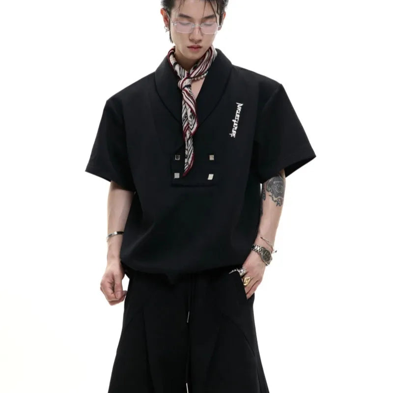 Man wearing a dark grey V-neck padded shoulder short sleeve jacket and matching shorts, a cotton sports suit set.