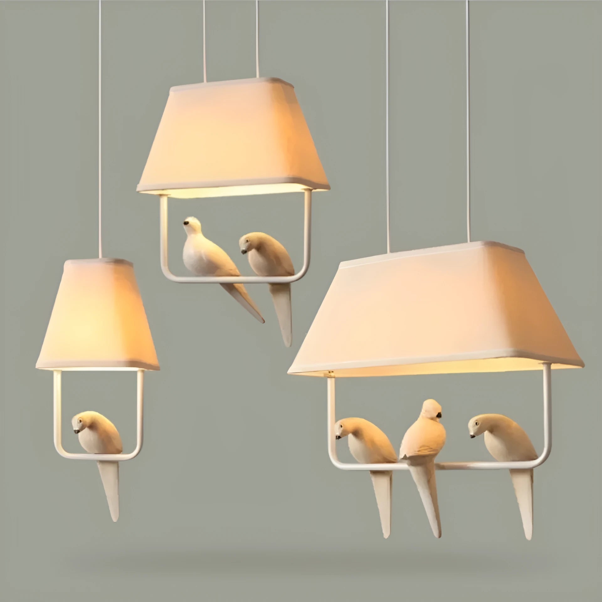 Iron ceiling chandelier with fabric shades featuring bird designs, hanging as a droplight.