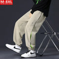 Men's loose cotton trousers with elasticated ankle bands and collage stitching details in khaki colour