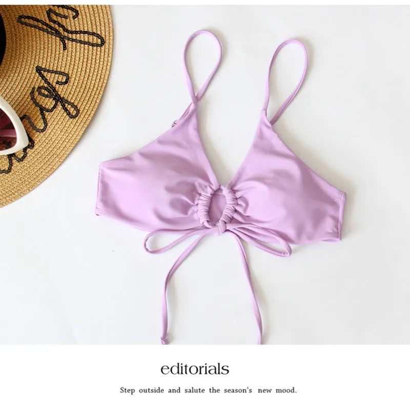 Women's pure colour bikini swimsuit with a tied bow detail, shown in one of eight available colours.