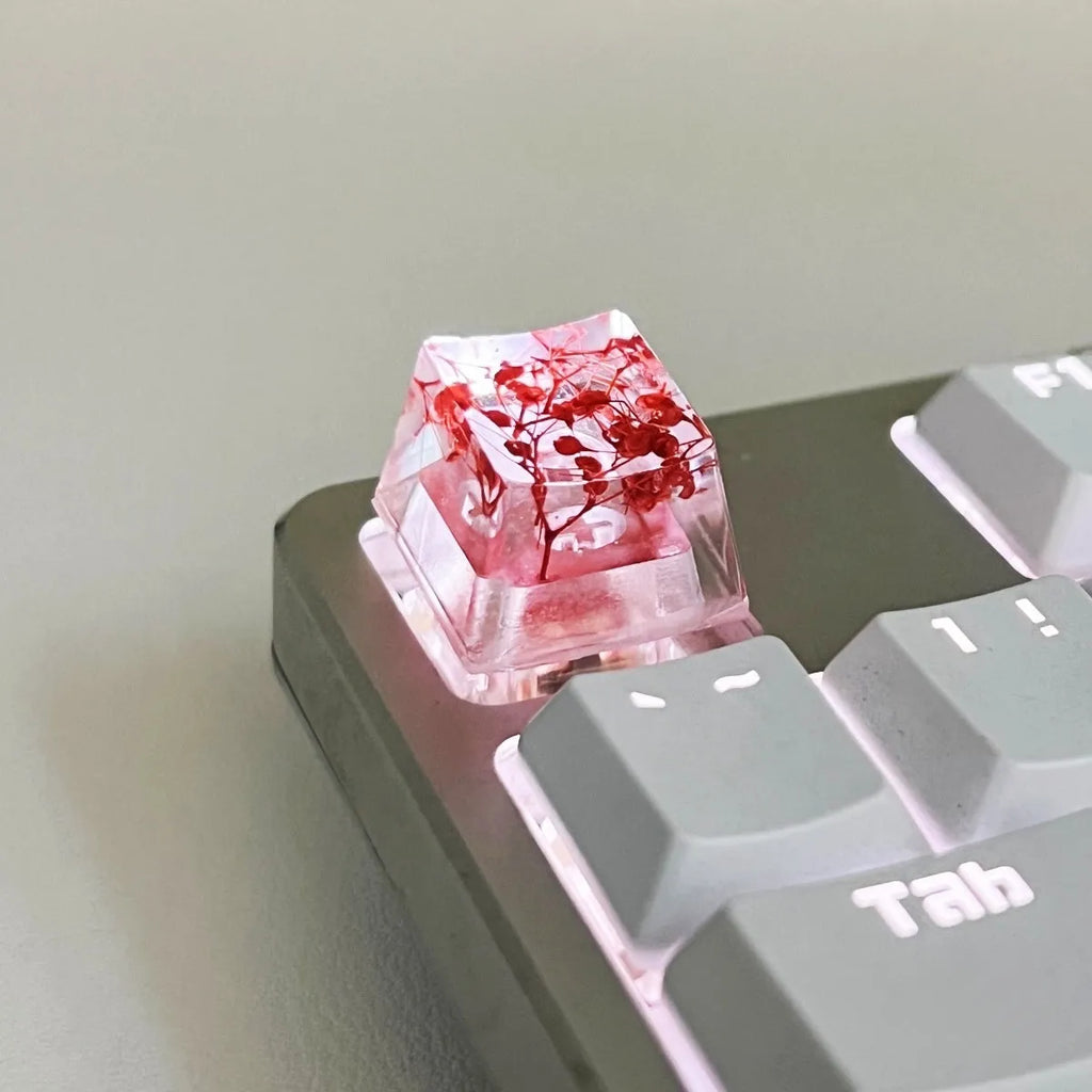 Transparent resin keycap with starry sky design in red, pink, green, or violet colours