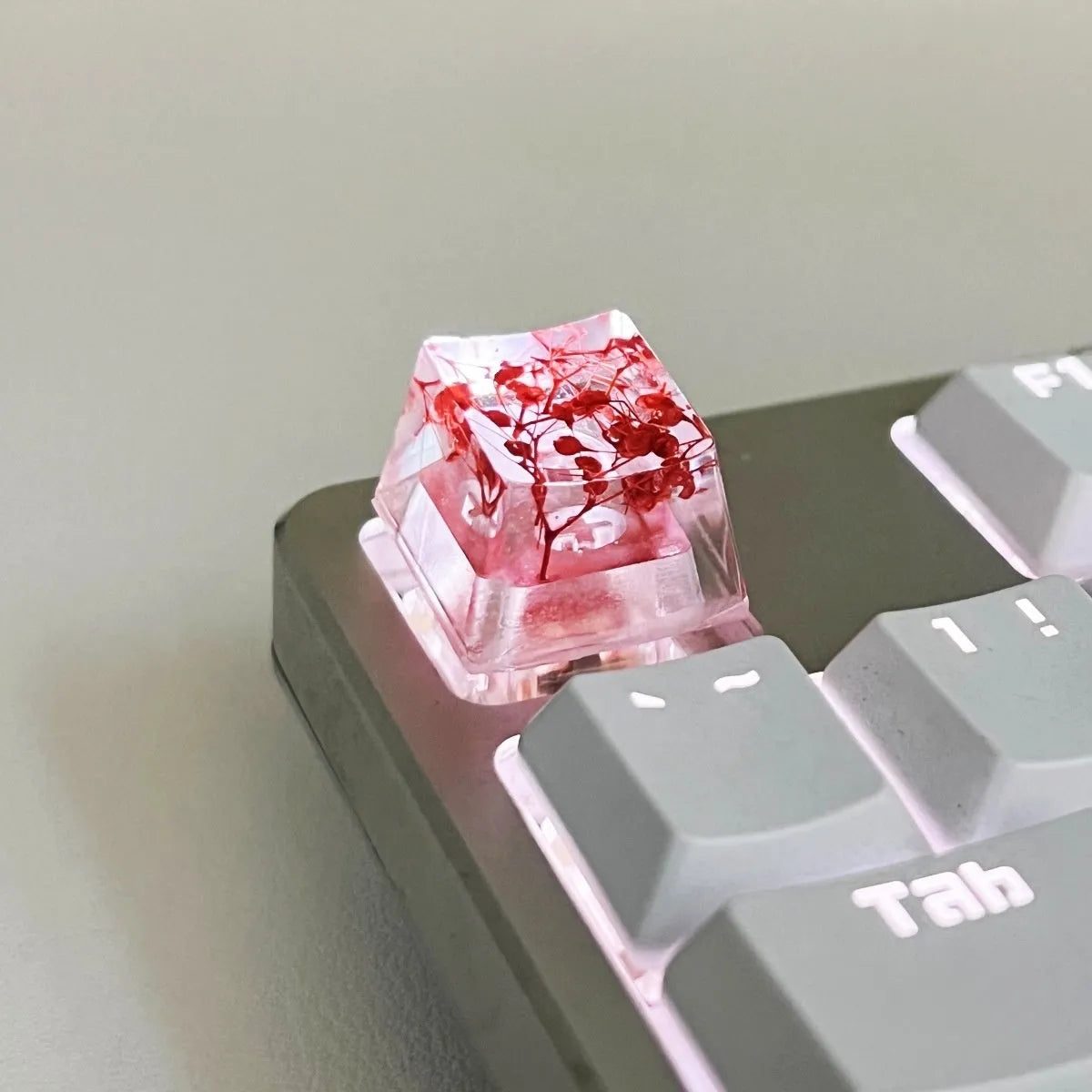 Transparent resin keycap with starry sky design in red, pink, green, or violet colours