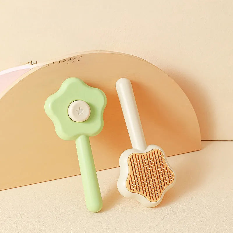 Green or yellow self-cleaning stainless steel cat comb measuring 20cm long