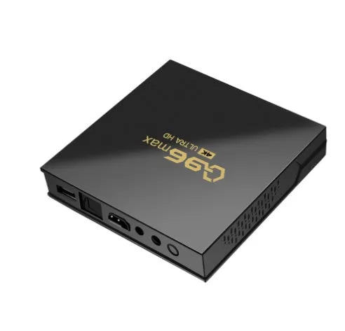 Q96 MAX S905 Android 4K TV Box set-top unit with remote control and cables on a black background.