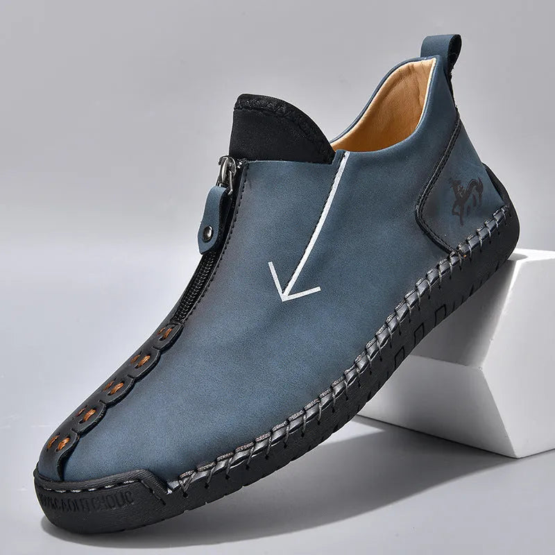Men's black front zip Martin boots with hand-stitching on artificial PU upper and rubber sole.