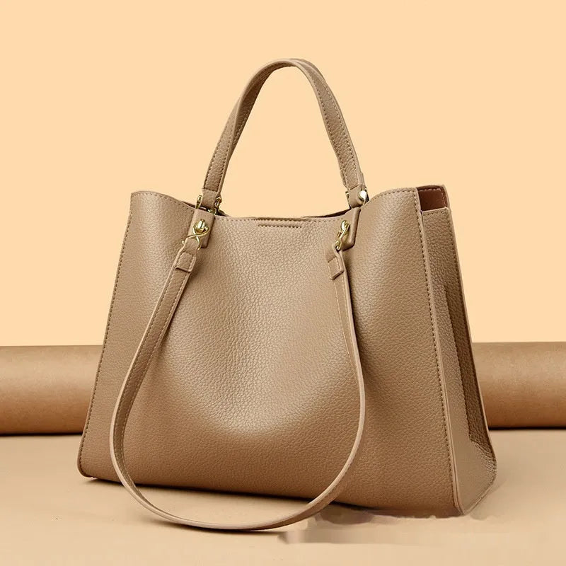 Women's PU leather messenger tote bag in horizontal square shape with visible stitching