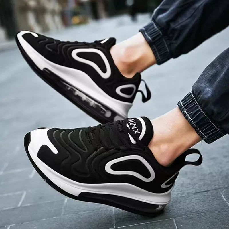 Men's black casual lace-up sneakers with a thick sole and round toe, shown on a white background.