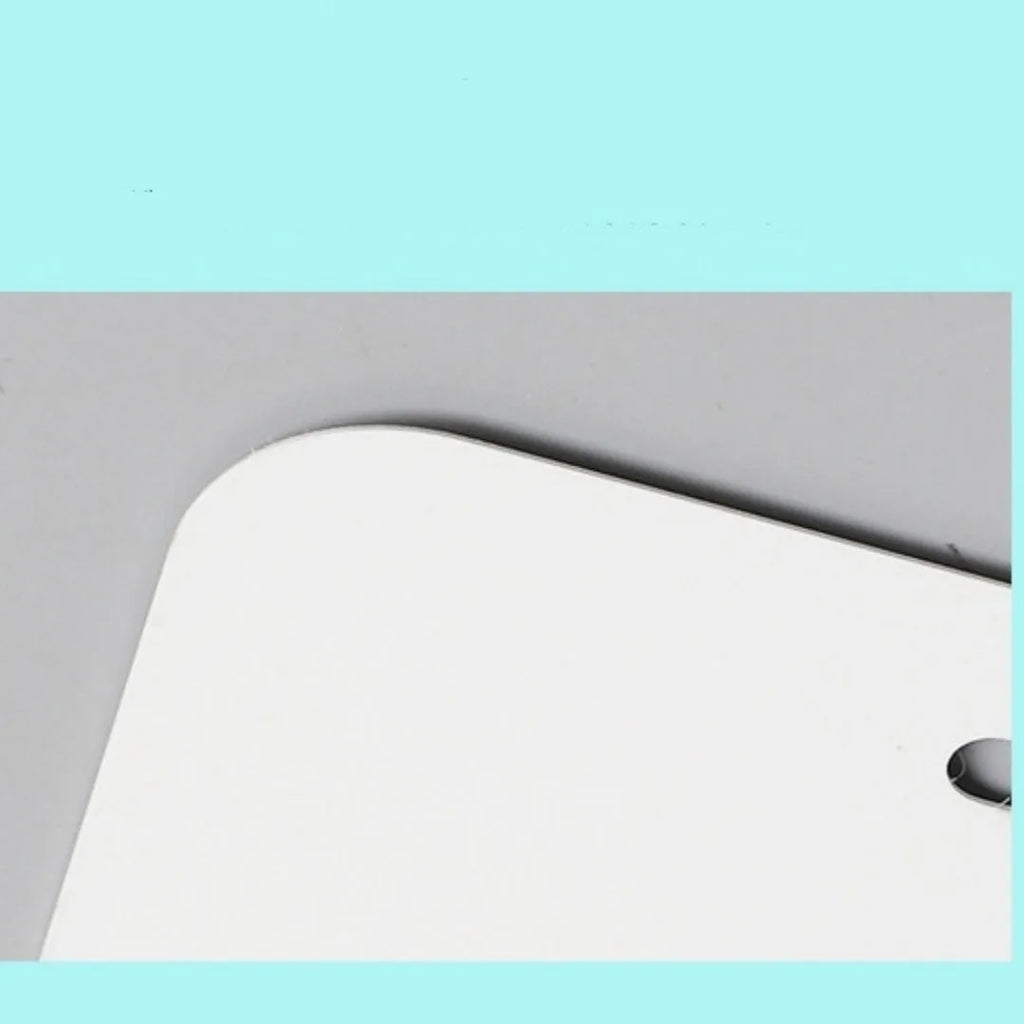 White rectangular aluminium licence plate blank with dimensions 30.3 by 15 centimetres.