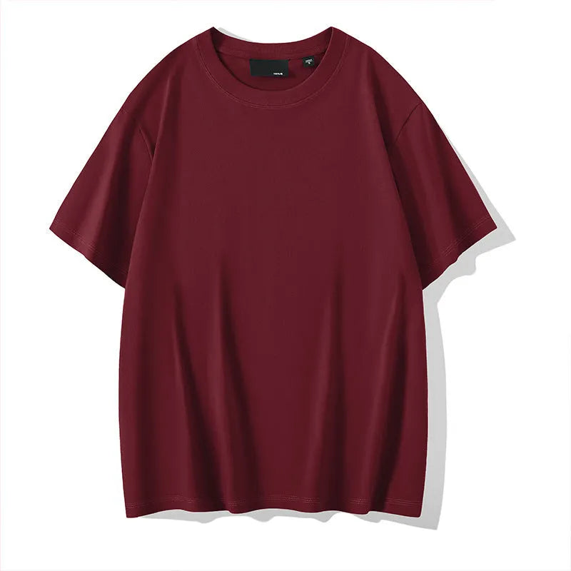 Men's loose fit casual cotton T-shirt in a solid colour with a round neck and drop shoulders.