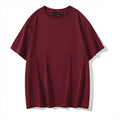Men's loose fit casual cotton T-shirt in a solid colour with a round neck and drop shoulders.