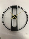 50cm round metal wall clock in black or gold finish on a wall