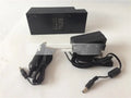 A compact dual USB car charger for 12V and 24V vehicles with a cigarette lighter plug.